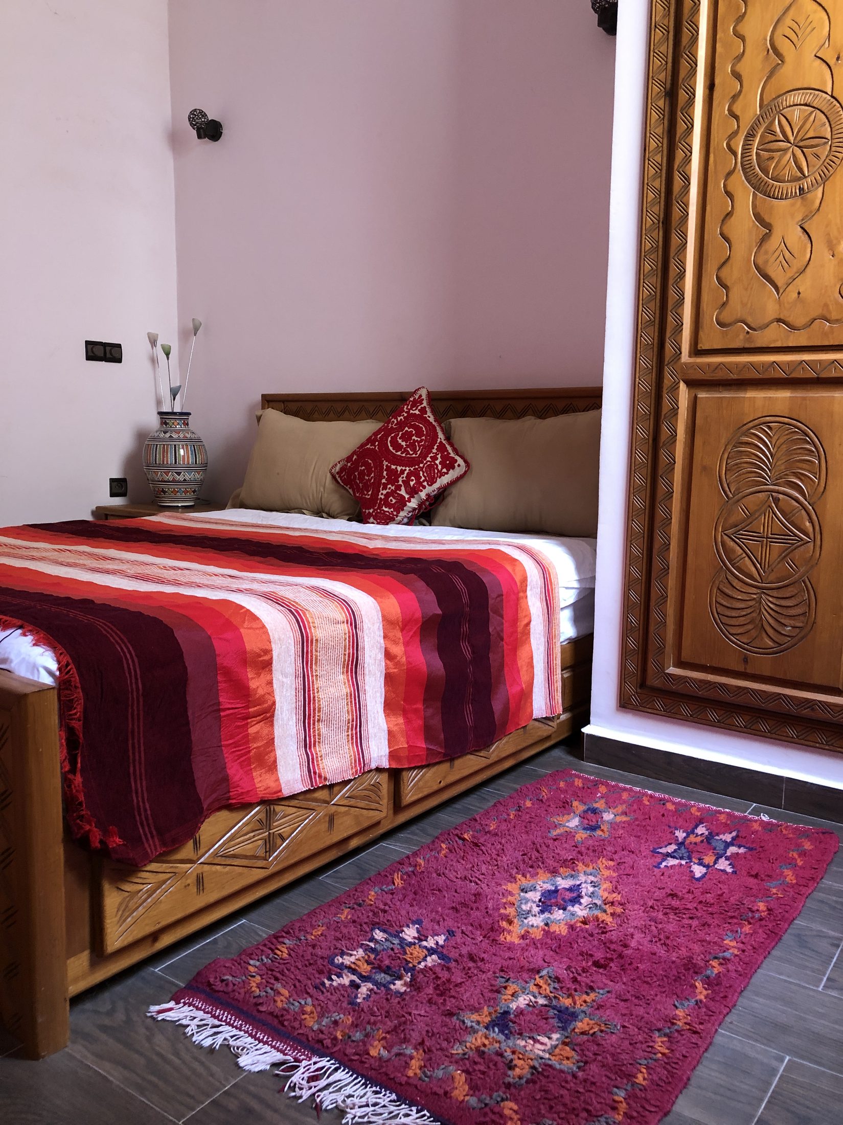 Private double room with carved wooden bed frame